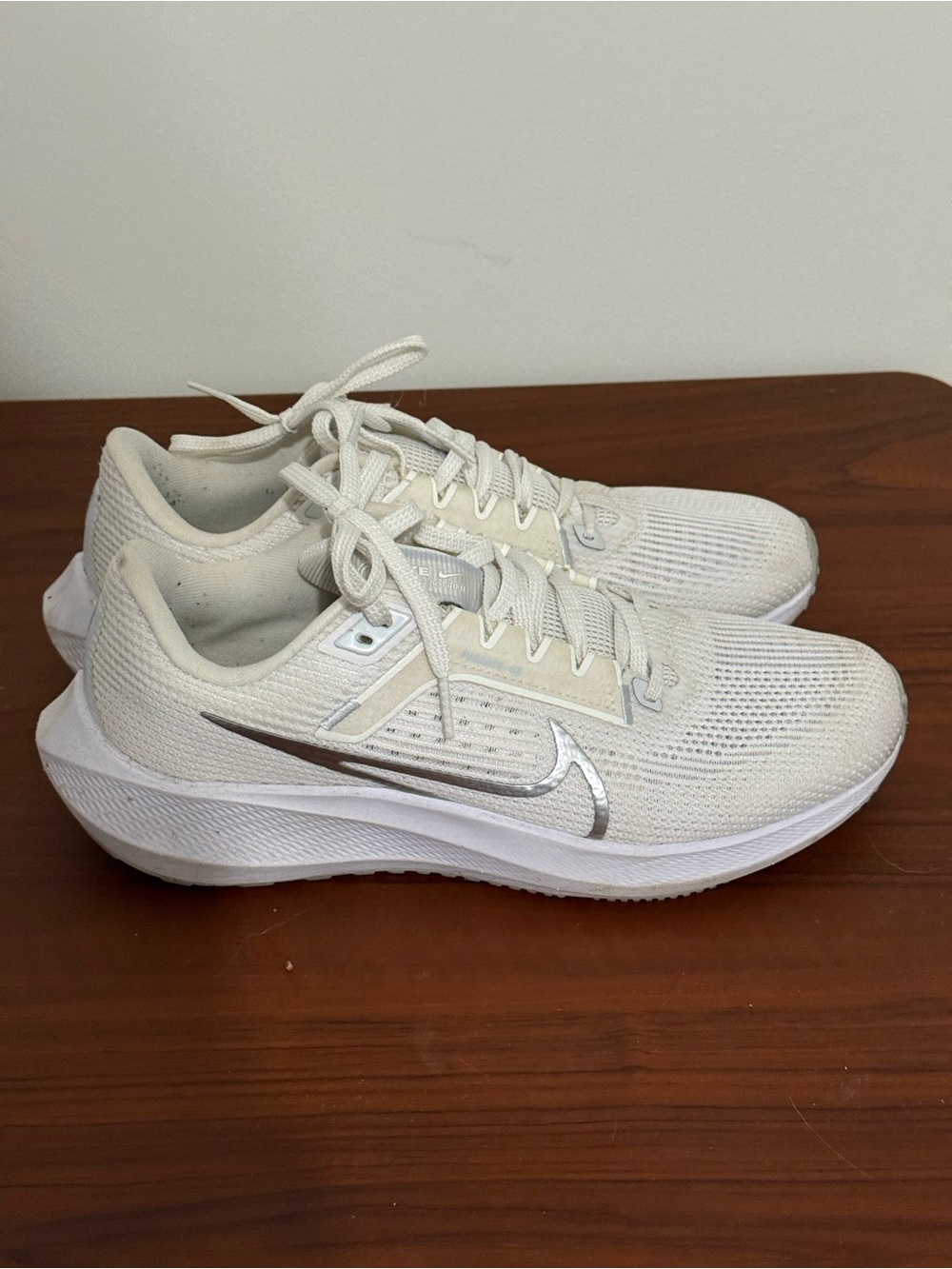 Nike Women’s Cream-White Running Sneakers with Silver Swoosh